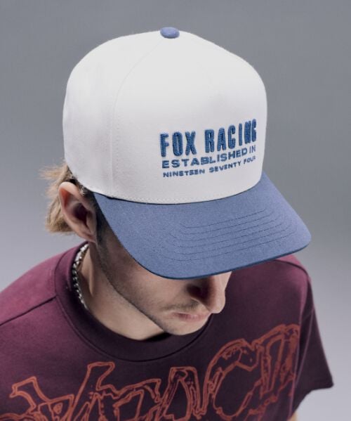 Man wearing white Fox hat