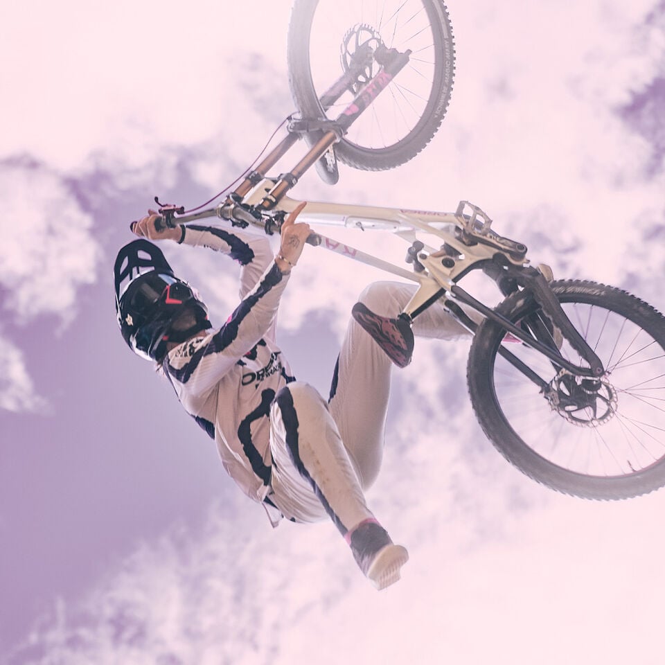 Person in air on MTB bike