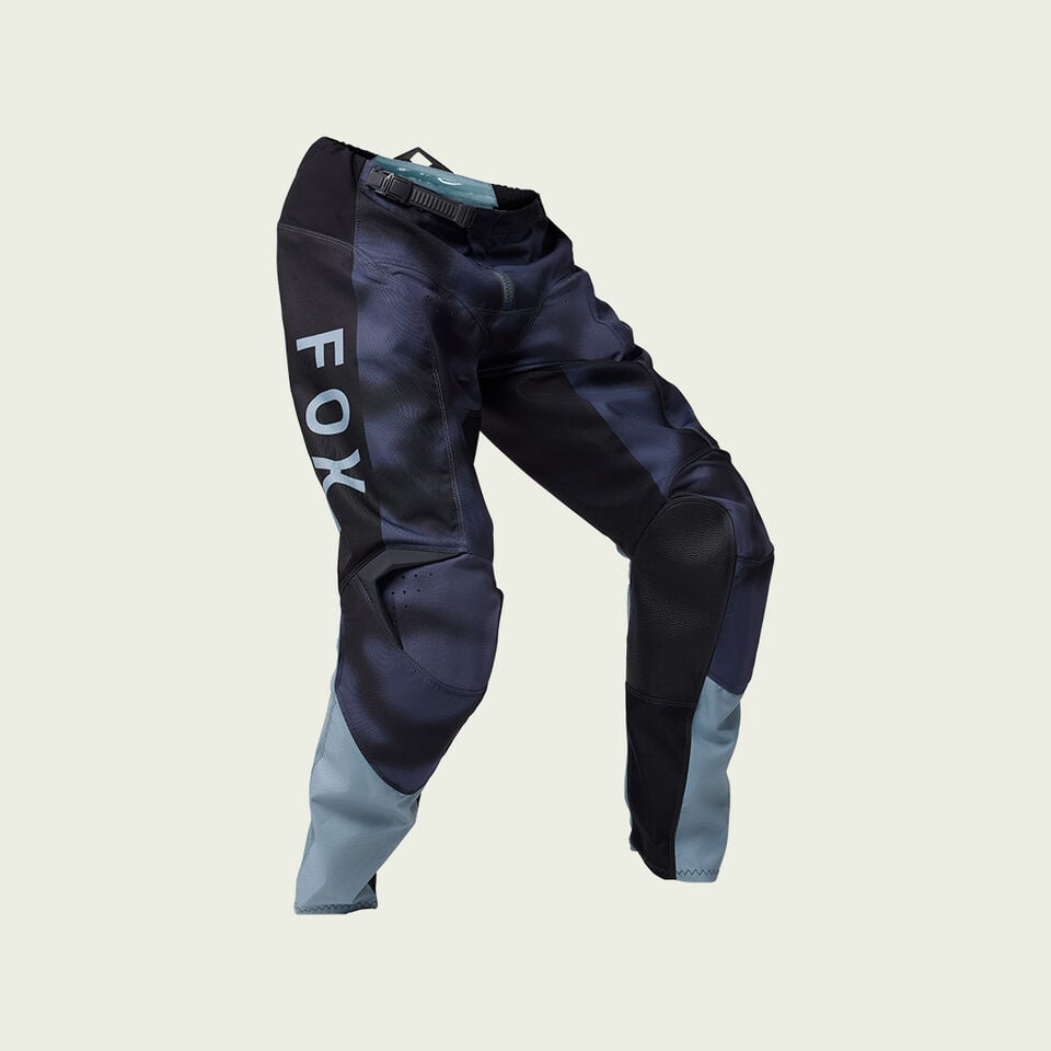 Black dirt bike pants with white stripes. 