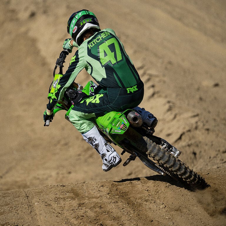 Kitchen riding a dirt bike