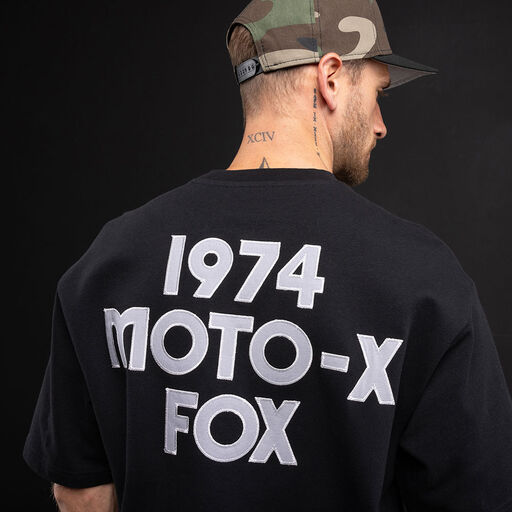 Person facing back with a Fox tee