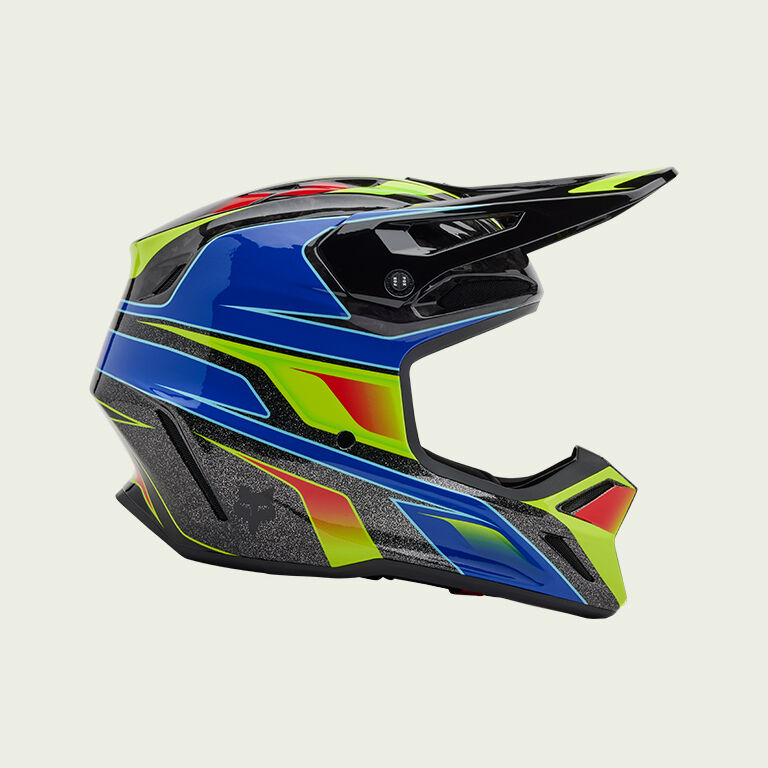 green and blue v3 rs helmet on green background