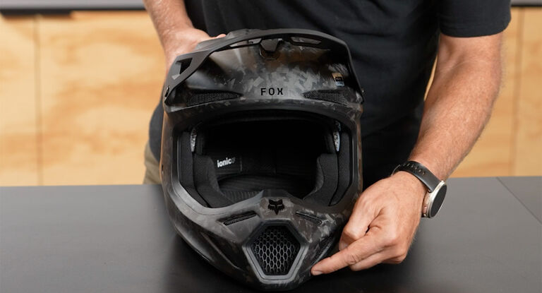 Man holding a V3RS helmet