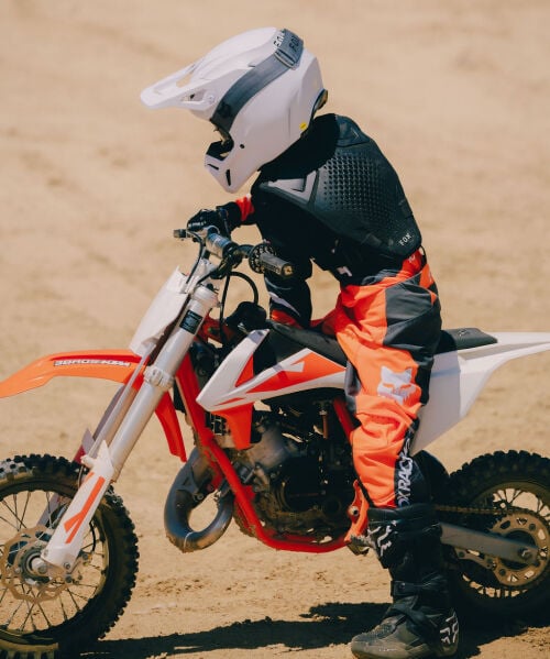 kid riding a dirt bike