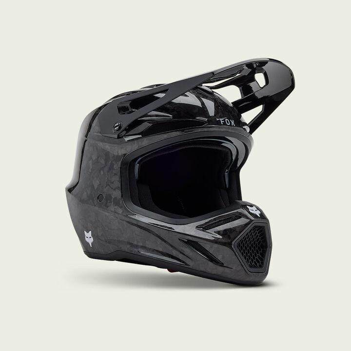 Black V3RS motocross helmet on a white background.