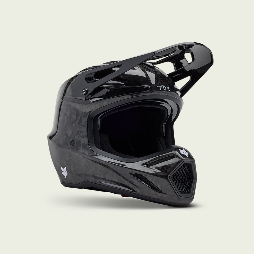 Black V3RS motocross helmet on a white background.