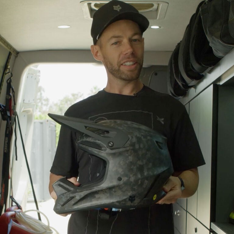 Person cleaning a helmet