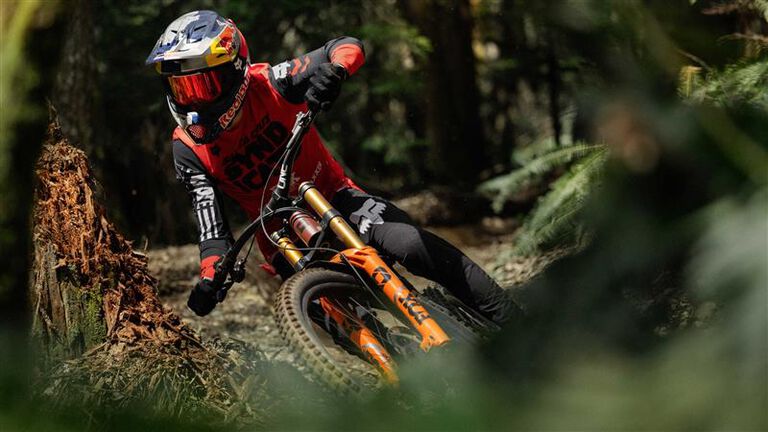 Rider going downhill on a bike with the Rampage RS helmet