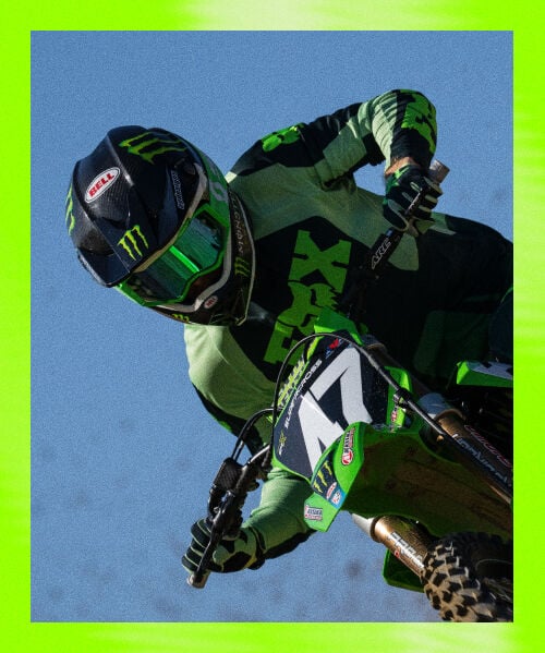 Person on moto bike wearing green and black