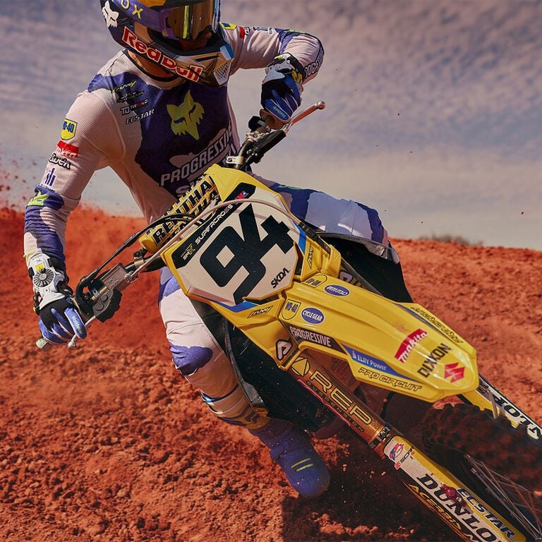 Moto rider on bike in dirt 