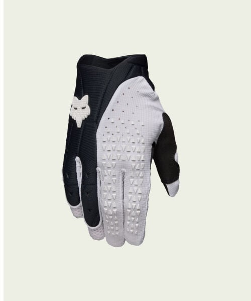 gant noir et blanc sur fond vert