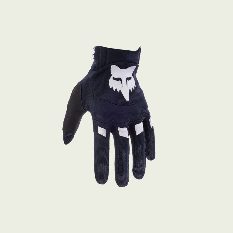 black and white glove on green background