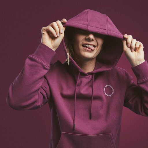 Woman wearing a red flannel over a black shirt.